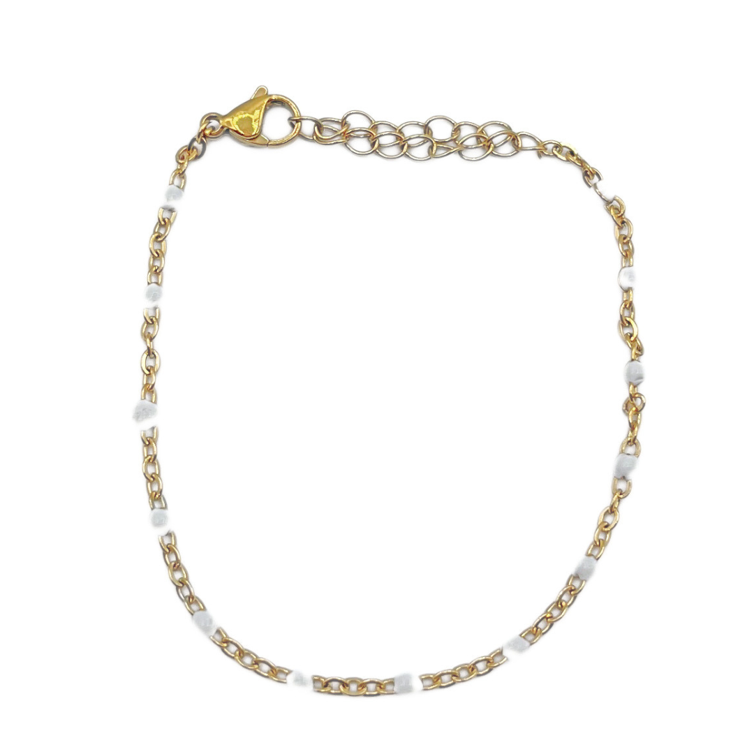 Witte bolletjes armband goud