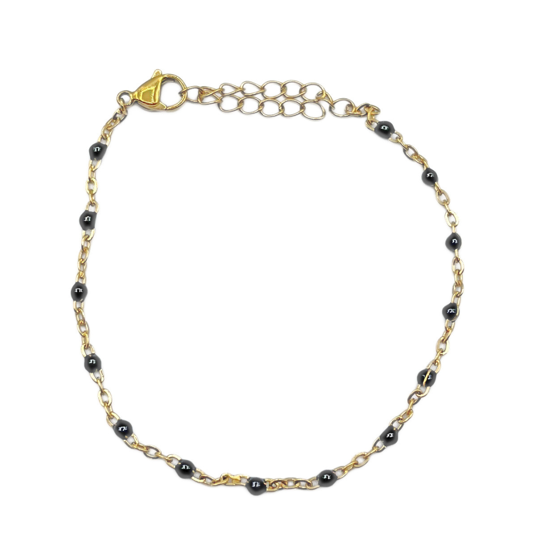 Zwarte bolletjes armband goud